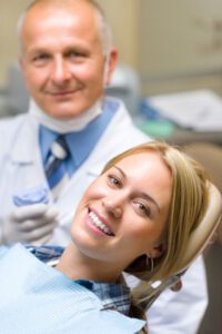 Smiling patient with dentist